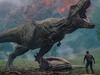 Chris Pratt faces a rampaging T-Rex dinosaur in a scene from film Jurassic World: Fallen Kingdom