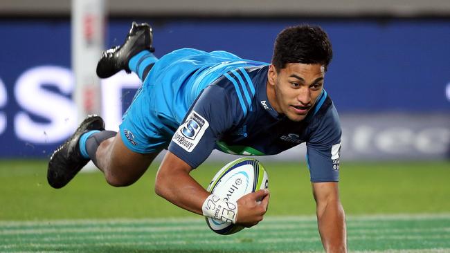 Blues' Rieko Ioane dives in for a try at Eden Park in Auckland.
