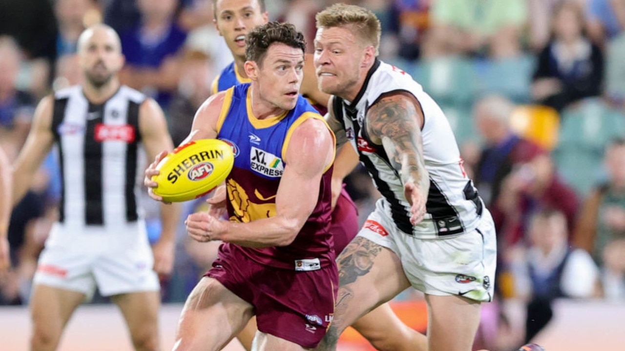 BRISBANE, AUSTRALIA - APRIL 14: Lachie Neale of the Lions carries the ball during the 2022 AFL Round 05 match between the Brisbane Lions and the Collingwood Magpies at the Gabba on April 14, 2022 In Brisbane, Australia. (Photo by Russell Freeman/AFL Photos via Getty Images)