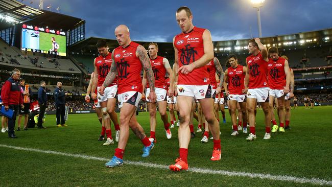 Nathan Jones and Daniel Cross lead the team off after Sunday’s loss. Picture: Colleen Petch