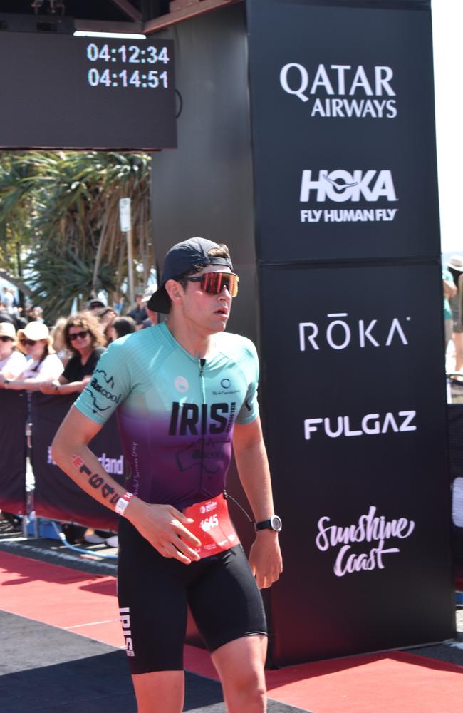 Athletes crossing the finish line at the Sunshine Coast Ironman 70.3 2023.