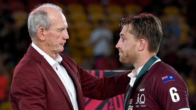 BRISBANE, AUSTRALIA - NOVEMBER 18: Cameron Munster of the Maroons is presented with the man of the match award by Maroons coach Wayne Bennett after game three of the State of Origin series between the Queensland Maroons and the New South Wales Blues at Suncorp Stadium on November 18, 2020 in Brisbane, Australia. (Photo by Bradley Kanaris/Getty Images)