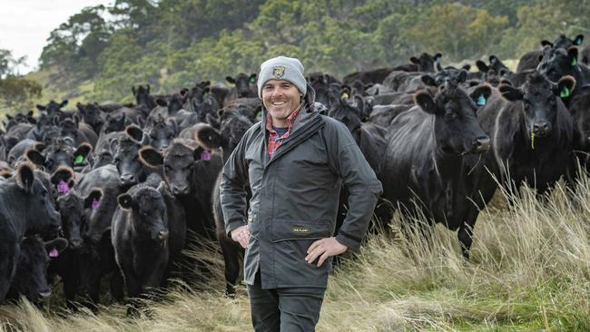 Sam White of Sidonia Beef, with Angus cattle on his Kyneton farm, where he uses holistic grazing or mobbing of cattle to mimic the large grazing herds of the African plains. Picture: Zoe Phillips