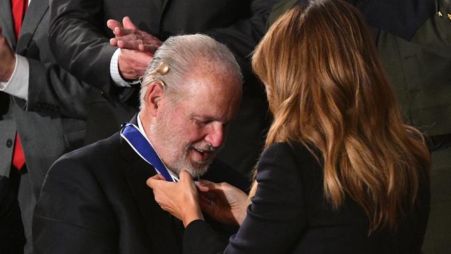 First Lady Melania Trump delivers the Medal of Freedom to radio personality Rush Limbaugh. AFP.