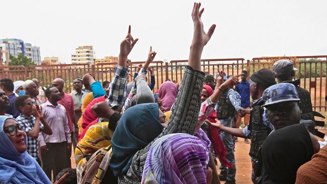 Demonstrators call for justice outside the Khartoum trail of Omar al-Bashir, who was leader when Bill Clinton listed Sudan as a state sponsor of terror. Picture: AFP