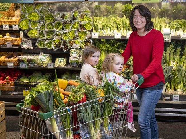 Family donating money to the Feed Appeal in store at Woolworths to help hit the target of 3 million meals for Aussies in need. Rebecca Winter with Winnie, 4, and Marla, 2 with their groceries.Picture by Wayne Taylor 23rd June 2021