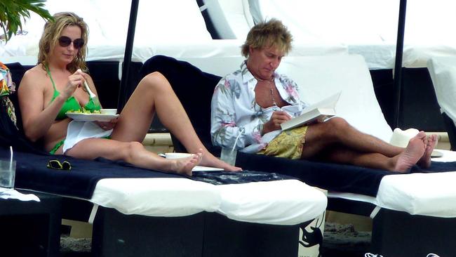 Penny Lancaster and Rod Stewart with family poolside at Palazzo Versace