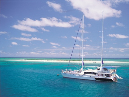 Quicksilver's catamaran takes tourists to the ege of the reef for snorkelling and swimming.