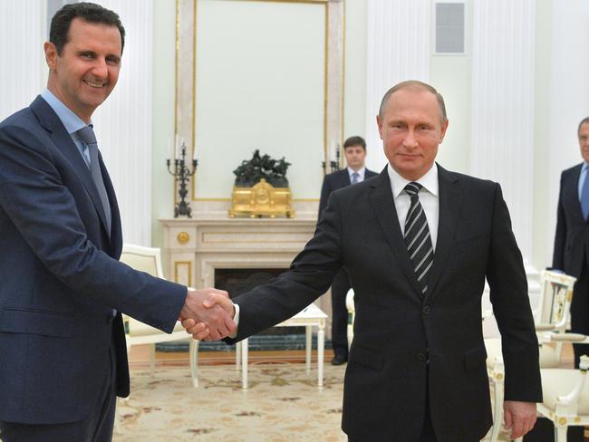 Syrian President Bashar Assad (left) has been blamed for the devastating attack. Picture: Alexei Druzhinin/AP