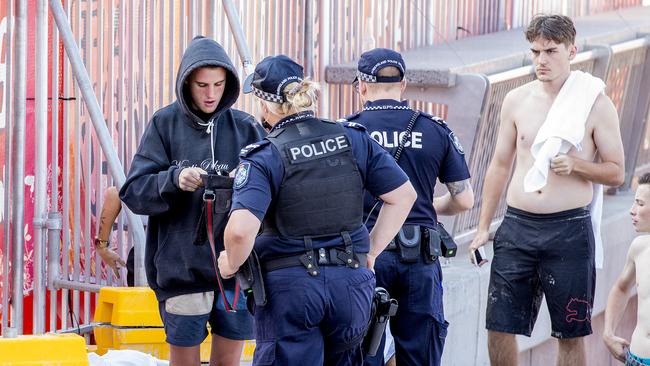 Police officers talking to youths during schoolies 2019 Picture: Jerad Williams.