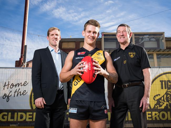 Holdfast Bay Mayor Stephen Patterson with Glenelg Tigers senior footballer Elliot Chalmers and CEO Glen Elliot, at Gliderol Stadium. Picture: Matt Loxton