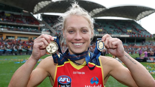 Erin Phillips of the Crows poses with her premiership and best-on-ground medals after Sunday’s match. Picture: Michael Willson/AFL Photos