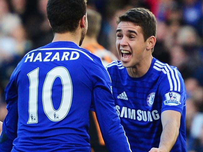 LONDON, ENGLAND - DECEMBER 13: Eden Hazard of Chelsea (10) celebrates with Oscar as he scores their first goal during the Barclays Premier League match between Chelsea and Hull City at Stamford Bridge on December 13, 2014 in London, England. (Photo by Jamie McDonald/Getty Images)