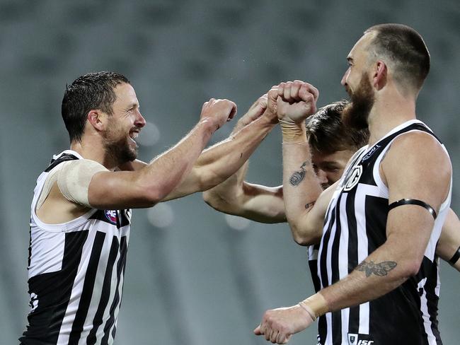 AFL - SHOWDOWN 48 - Port Adelaide v Adelaide Crows at the Adelaide Oval. Travis Boak celebrates his goal with Robbie Gray and Charlie Dixon Picture SARAH REED