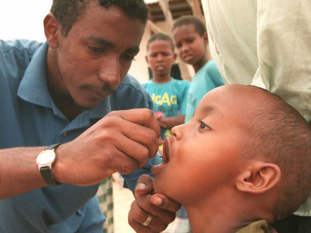 A child is vaccinated against polio in northern Kenya in 1996.