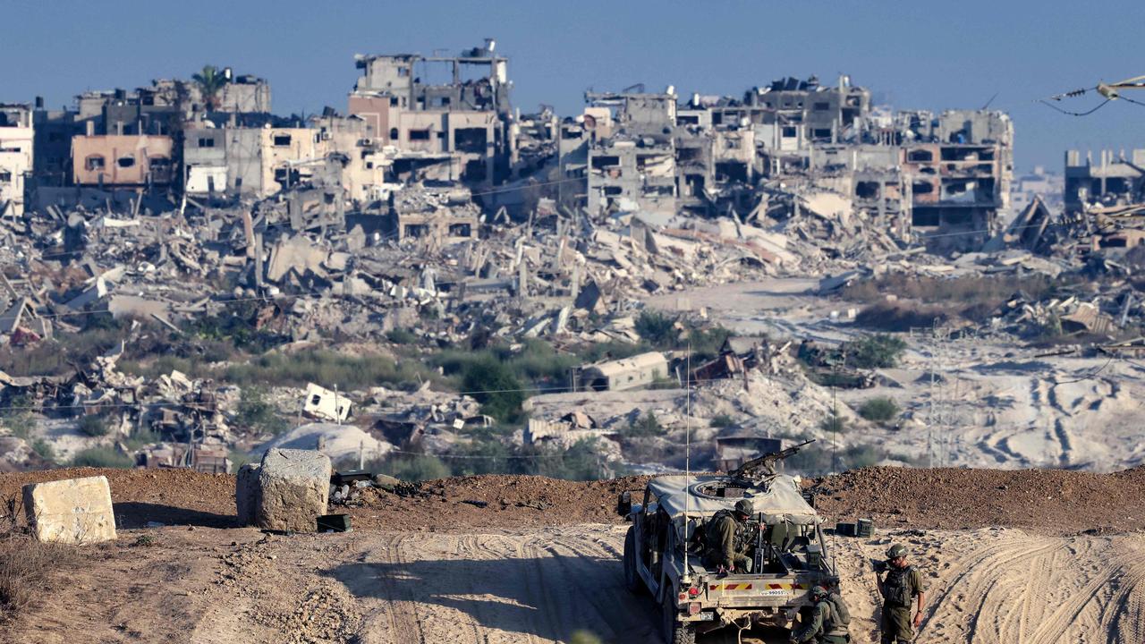 Israeli troops operate on their side of the fence separating Israel from the Gaza Strip on August 29, 2024, amid the ongoing conflict between Israel and the militant group Hamas. (Photo by JACK GUEZ / AFP)