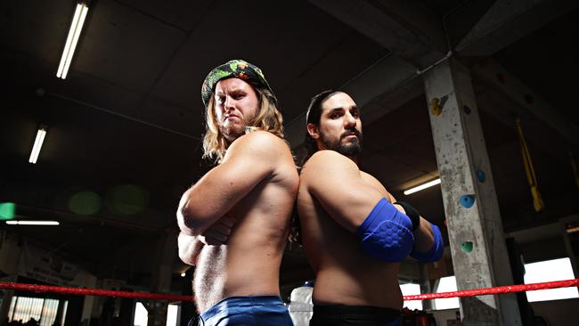 Jackson Kelly with fellow pro wrestler Apollo. Picture: Adam Yip.