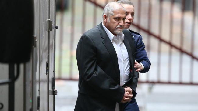 Fernando Paulino is taken from a prison van into the Victorian Supreme Court during his 2017 trial. Picture: David Crosling/AAP