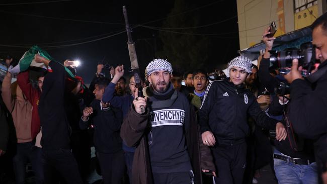 People celebrate in Khan Yunis in the southern Gaza Strip as news spread that a ceasefire and hostage release deal had been reached between Israel and Hamas. Picture: AFP