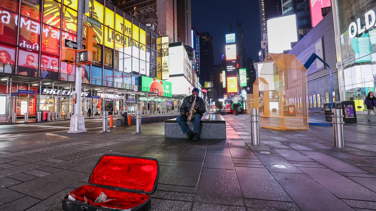 A man plays the saxophone in an empty Times Square on April 24, 2020 in New York City. Due to stay-at-home orders in New York, the New York streets continue to remain eerily empty. Picture: Arturo Holmes/Getty Images