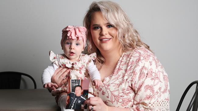 Jacinta Djokovic found out she was pregnant with daughter Isla, now 6 months, after 18 months of IVF. She’s holding a picture of her father Gregory Colin Tonks, who was battling terminal cancer and died a few months after his granddaughter was born. Picture: NIKKI DAVIS-JONES