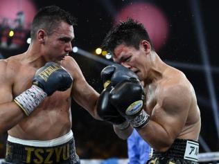 Tim Tszyu lands a short left on Inoue.