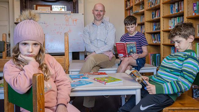 Fitzroy Community School principal Tim Berryman with his kids Abi, 7, Xavier ,9, and Christian, 11. Picture: Jason Edwards