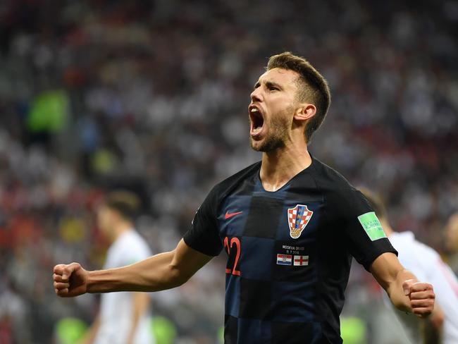 MOSCOW, RUSSIA - JULY 11:  Josip Pivaric of Croatia celebrates after teammate Mario Mandzukic scores their team's second goal during the 2018 FIFA World Cup Russia Semi Final match between England and Croatia at Luzhniki Stadium on July 11, 2018 in Moscow, Russia.  (Photo by Dan Mullan/Getty Images)