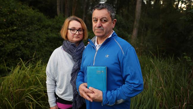 Joe and Sandra Cimino at their home in Warriewood, Sydney. Joe (holding a diary that he wrote in at the time) has recalled the concreting he did at Chris and Lyn Dawson's old house at 2 Gilwinga Drive. Picture: John Feder