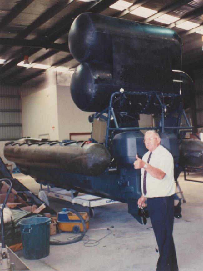 Ken Brown with an inflatable boat he helped develop for the Royal Australian Navy. Picture: Supplied