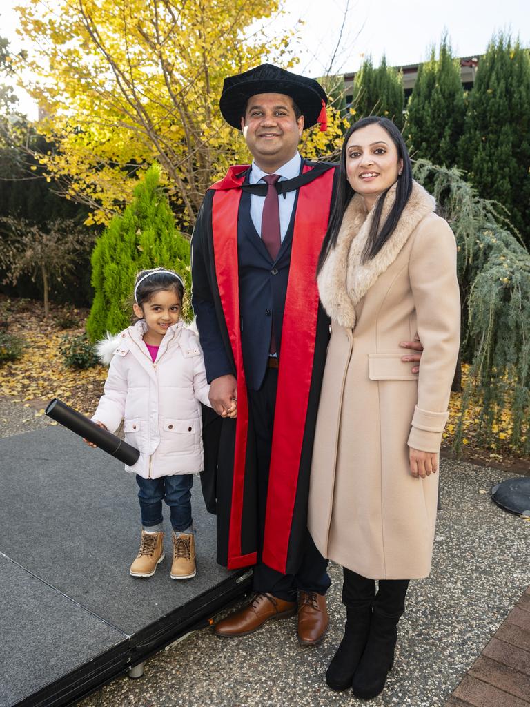Doctor of Philosophy graduate Arvind Sharda with daughter Violet Sharda and wife Ritu Sharma at a UniSQ graduation ceremony at Empire Theatres, Wednesday, June 28, 2023. Picture: Kevin Farmer