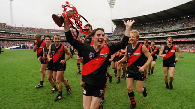 SEPTEMBER 25, 1999 : Bombers players celebrate victory after Essendon v St Kilda Reserves AFL grand final at Melbourne Cricket Ground (MCG), 25/09/99. Pic Darren Tindale.Australian Rules