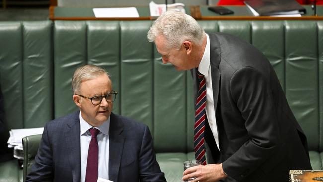 Anthony Albanese and Workplace Relations Minister Tony Burke confer during question time in Canberra on Tuesday. Picture: AAP