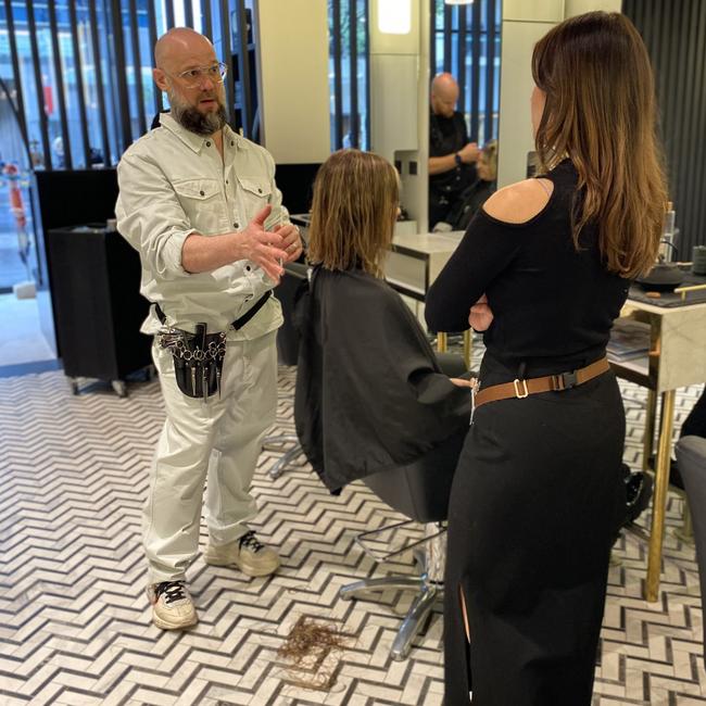 Mr Pace educating the next generation at his salon. Picture: Supplied