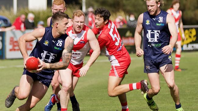 Launceston’s Josh Woolley races away from Clarence’s Josh Green. Picture: Andrew Woodgate