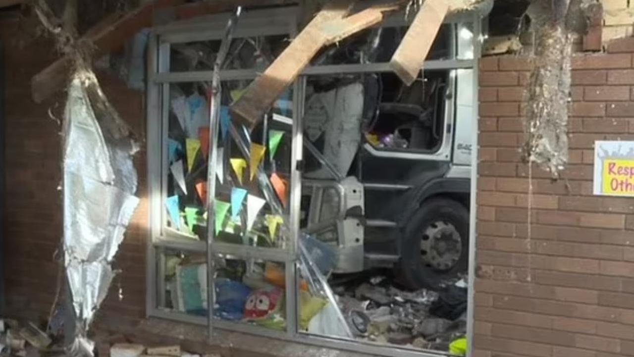 Multiple vehicles and a school building were damaged when a truck drove through an intersection at Moorebank, Sydney, on June 29, 2024. Picture: 7News