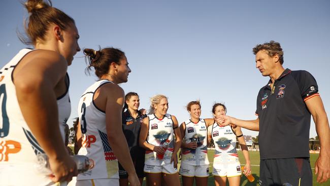 Adelaide head coach Matthew Clarke speaks to his players after the Round 7 AFLW match against Melbourne. Picture: AAP Image/Daniel Pockett