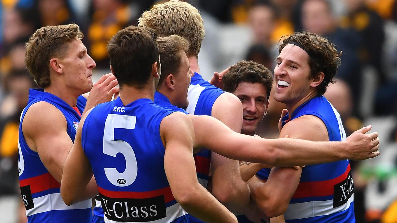 Tom Liberatore celebrates a crucial goal with his teammates. Picture: Getty Images