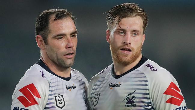 GOSFORD, AUSTRALIA – JUNE 13: Cameron Smith (L) of the Storm celebrates with Cameron Munster (R) at full time during the round five NRL match between the Newcastle Knights and the Melbourne Storm at Central Coast Stadium on June 13, 2020 in Gosford, Australia. (Photo by Matt King/Getty Images)