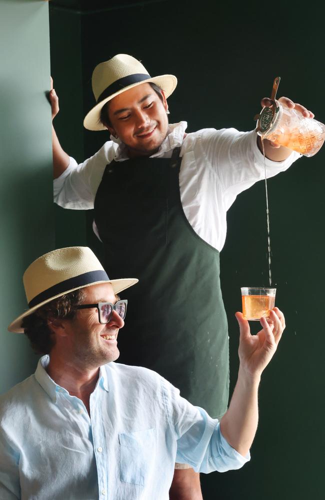 Familiar Spirits distillery has opened in Burleigh Heads. Barman Danson Danium pours Owner Justin Bell a drink.. Picture Glenn Hampson