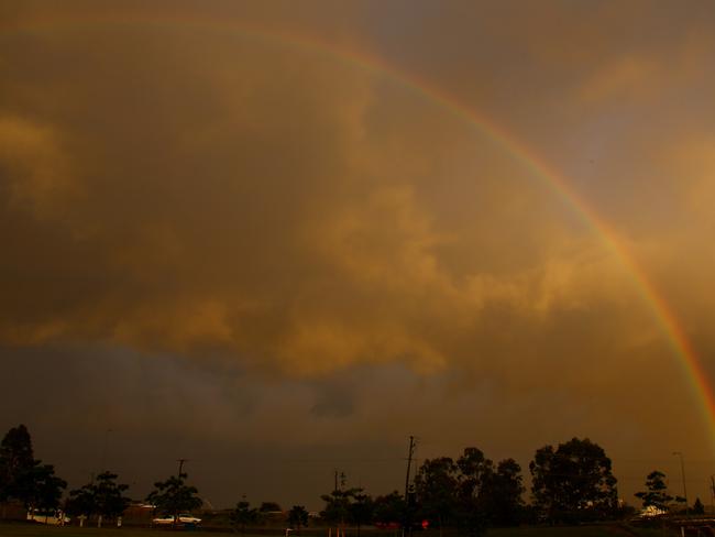 A serve weather warning was issued late this afternoon for the Gold Coast area - After the storm comes sunshine, playtime and a rainbow  Photo: David Clark