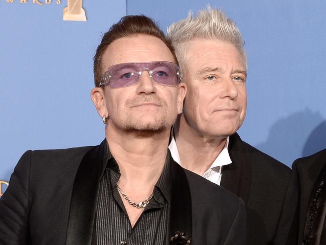 BEVERLY HILLS, CA - JANUARY 12:  (L-R) Musicians Larry Mullen Jr., Bono, Adam Clayton and The Edge of U2, winners of Best Original Song for 'Ordinary Love' from 'Mandela: Long Walk to Freedom,' pose in the press room during the 71st Annual Golden Globe Awards held at The Beverly Hilton Hotel on January 12, 2014 in Beverly Hills, California.  (Photo by Kevin Winter/Getty Images)