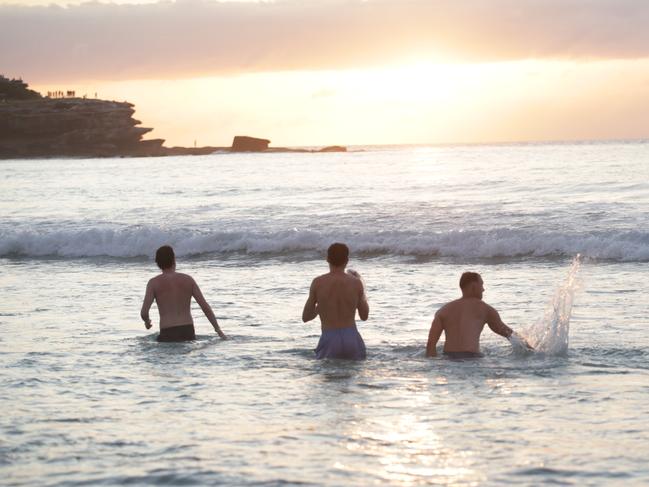 SYDNEY, AUSTRALIA - NewsWire Photos - 01 JANUARY, 2025:Early morning sunrise coverage from Sydney's iconic Bondi Beach as the first day of 2025 rings in with revellers from New Years Eve still enjoying festivities as dawn breaks.Picture: NewsWire / Christian Gilles