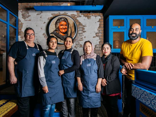 Plate It Forward co-founder Shaun Christie-David (right) with staff at Afghan venue Kabul Social. Picture: Supplied