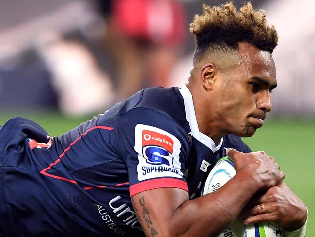 TOPSHOT - Rebels player Will Genia dives over the try line to score against the Sunwolves in the Super Rugby match between Australia's Melbourne Rebels and Japan's Sunwolves in Melbourne on April 6, 2019. (Photo by WILLIAM WEST / AFP) / -- IMAGE RESTRICTED TO EDITORIAL USE - STRICTLY NO COMMERCIAL USE --