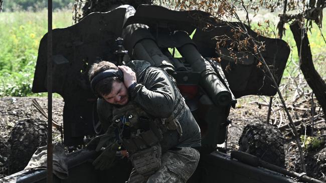 A Ukrainian artilleryman fires a howitzer D-20 at Russian positions. Picture: AFP