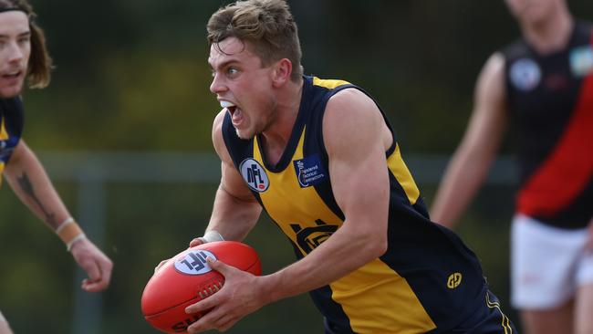 Tom Simpson in action for Hurstbridge. Picture: Stuart Milligan