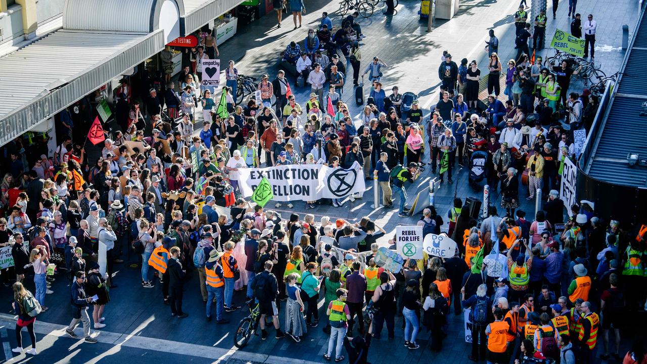 Protesters and police at the Extinction Rebellion protest for climate change action in Rundle Mall. Picture: AAP / Morgan Sette