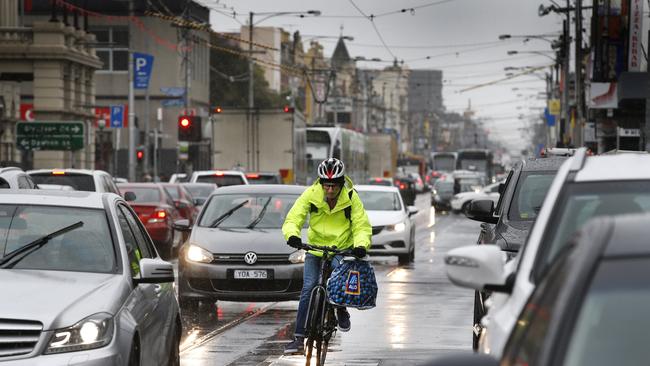 Cyclists on Sydney road. Carparking would be banned from Sydney Rd for six months under a proposed trial that traders say could ruin businesses. Picture: David Caird