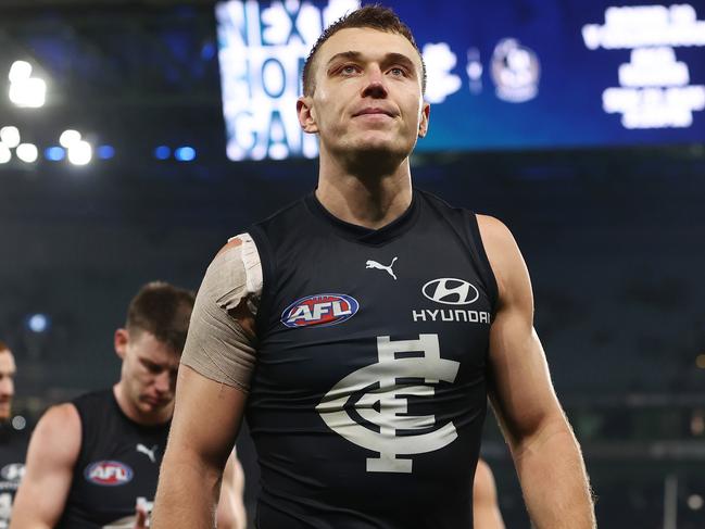 MELBOURNE. 13/05/2023.  AFL. Round 9. Carlton vs Western Bulldogs at Marvel Stadium.  Patrick Cripps leads the Blues off Marvel Stadium   .  Pic: Michael Klein